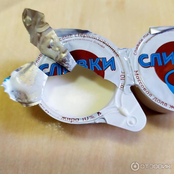 Сливки порционные Campina 10% фото